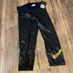 Nike Women’s Black Capri Leggings with Metallic Gold Swoosh